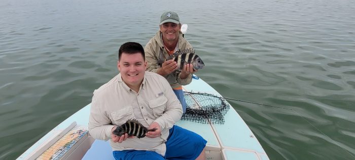 Pat and Ken hold up 2 of there sheepshead