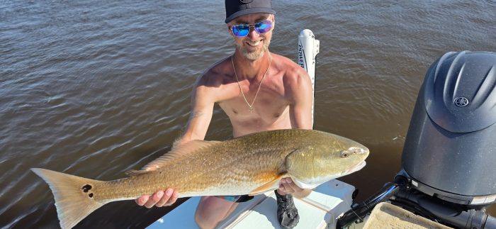family charter and a big redfish